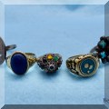 J11. Gold and sterling rings. 